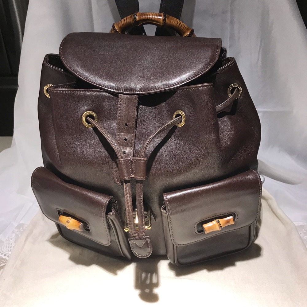 Brown Gucci Leather Backpack with Signature Bamboo Top Handle.